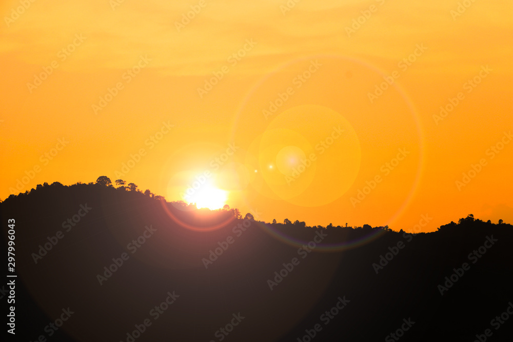 Sunset and orange sky over the natural mountain ranges