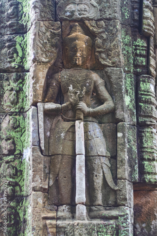 Detail of sculpted stone in temple in Angkor.