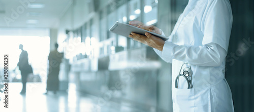 Healthcare and medicine. Medical and technology. Doctor working on digital tablet on hospital background photo