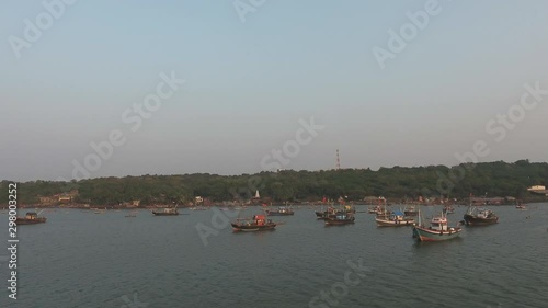 Wallpaper Mural drone zoom out shot of  fishing boats in a small port Torontodigital.ca