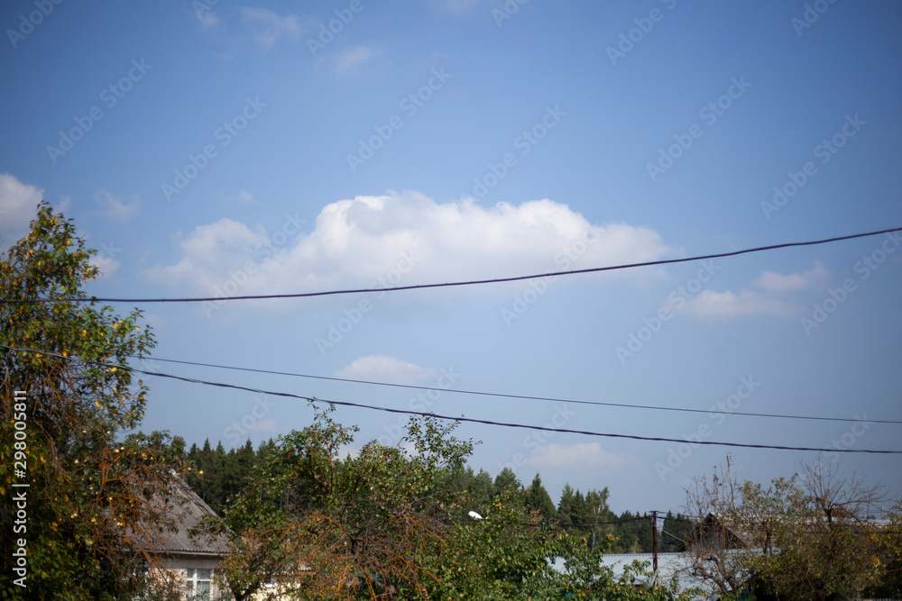 Cloud lies on a wire. Background of sky and wires.