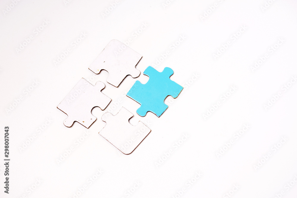 White with single blue jigsaw puzzle isolated White with single blue jigsaw puzzle isolated