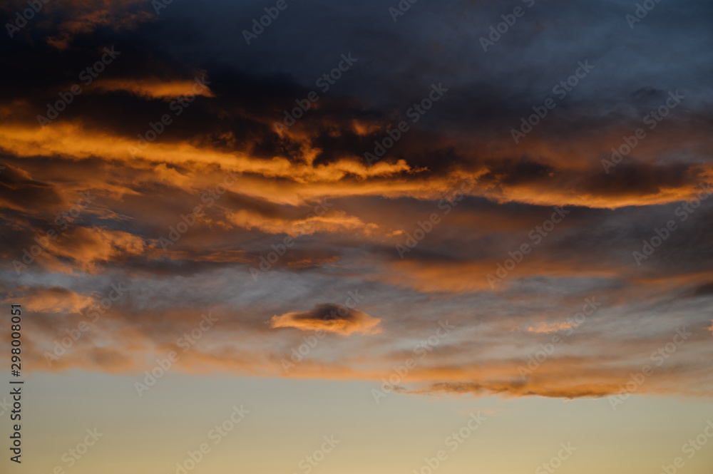 Dramatic sky with orange clouds. Nature background.