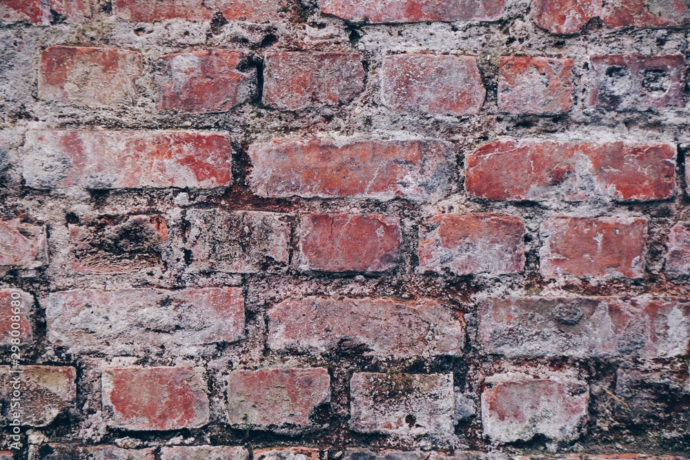 Obraz premium old stone wall of the building on the street