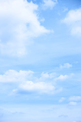 Pastel blue sky with light clouds