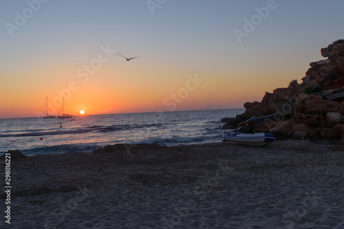 Sunset at Cala Saona, Formentera, in the distance Es Vedra Rock is visible