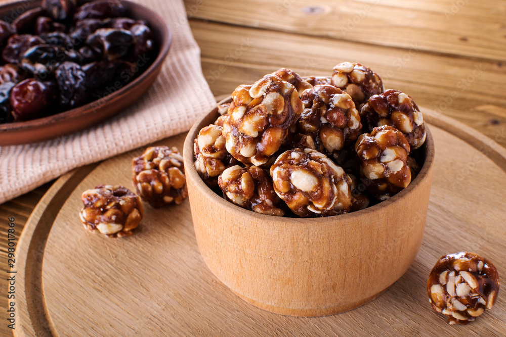 Vegan delicious sweet cocoa and almond balls on wooden table healthy food Vegan delicious sweet cocoa and almond balls on wooden table healthy food