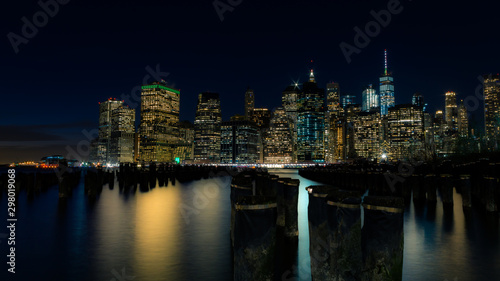 Lower Manhattan at night with the old pier posts