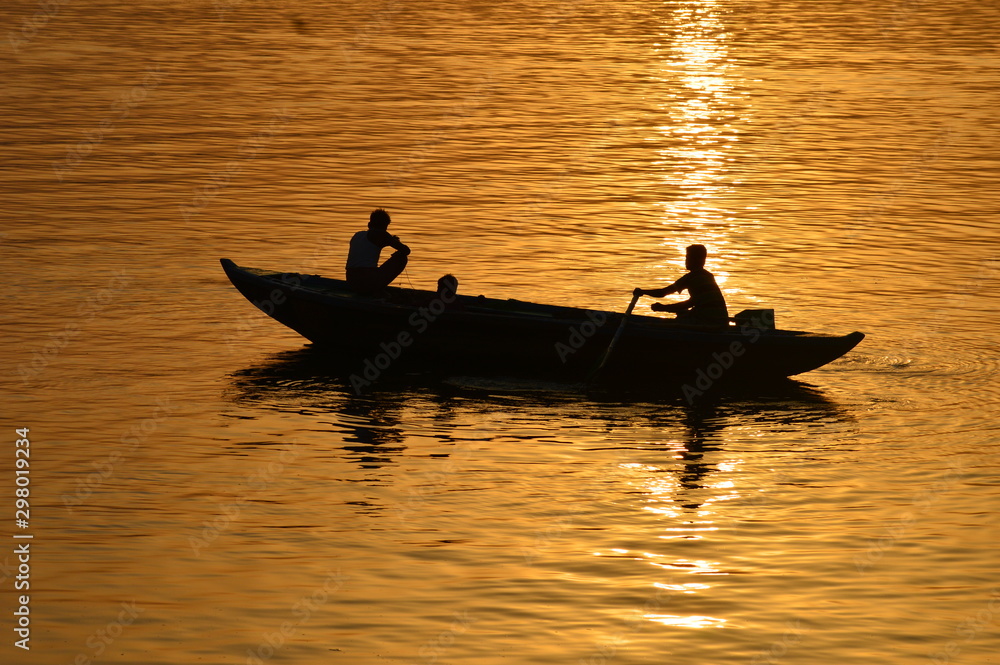 boating in morning time in varanasi at holy river ganga