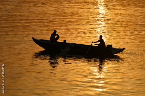 boating in morning time in varanasi at holy river ganga