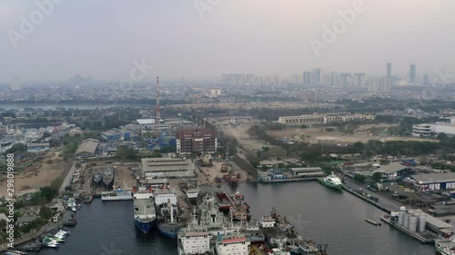 Aerial view of tanjung priok port near Ancol. Hazy and foggy crowded City View photo