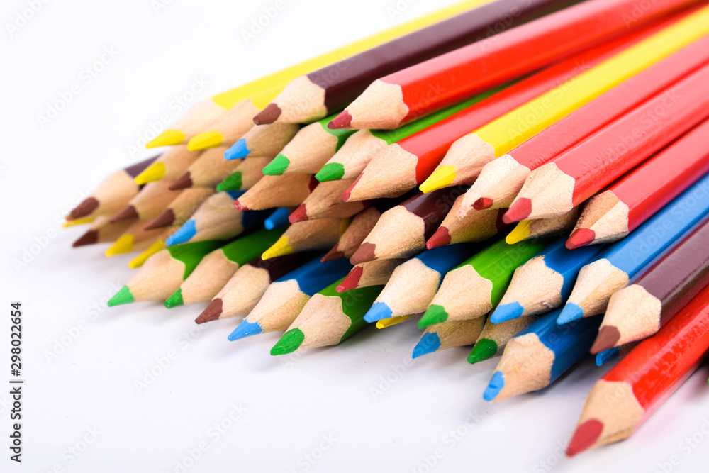 Many different colored pencils on a white background with a place for text and cory space . Many different colored pencils on a white background with a place for text and cory space .