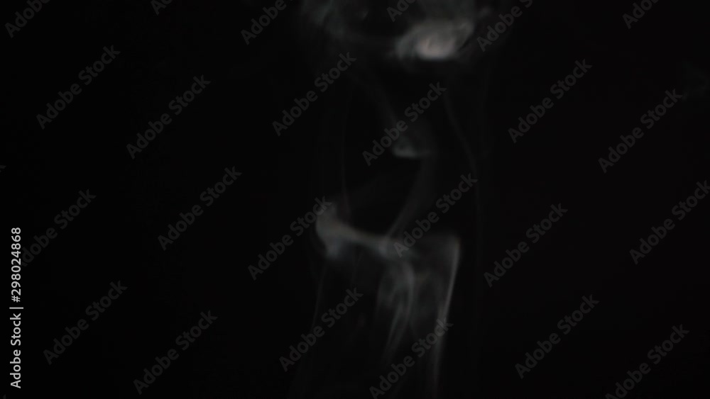 White steam spins and rises from the pan. White smoke rises from a large pot, which is located behind the frame. Isolated seamless loop black background. Texture of smoky cloud, 4k White steam spins and rises from the pan. White smoke rises from a large pot, which is located behind the frame. Isolated seamless loop black background. Texture of smoky cloud, 4k