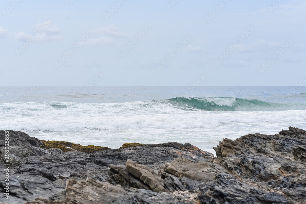 Rocks and sea at Snapper Rocks on the Gold Coast Australia. White sea wash with waves over a rocky coastline. Rocks and sea at Snapper Rocks on the Gold Coast Australia. White sea wash with waves over a rocky coastline.