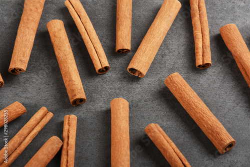 Cinnamon sticks on the gray stone texture with copy space 