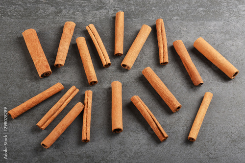 Cinnamon sticks on the gray stone texture with copy space 