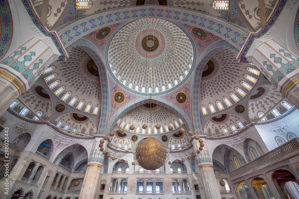 Ankara, Turkey - Inside interior view of the Kocatepe Mosque (Kocatepe Cami), featuring its ornate domes, pillars and windows.