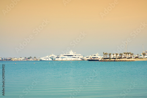 White yachts parking at the harbour island gulf sea over sky in Amwaj, Bahrain.