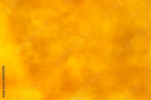 Delicate golden texture bokeh background. blurred yellow autumn background