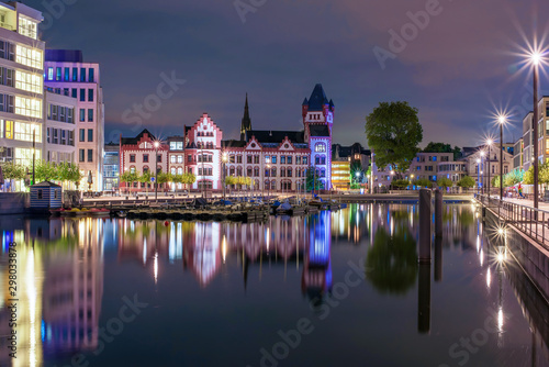 Amazing nightscape of Hoerde Castle and Phoenix Lake in Dortmund, Germany illuminated at night
