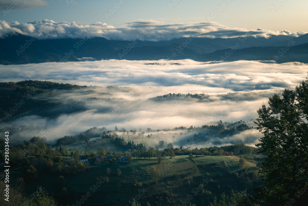 Fototapeta premium Misty sunset on pyrenees mountains