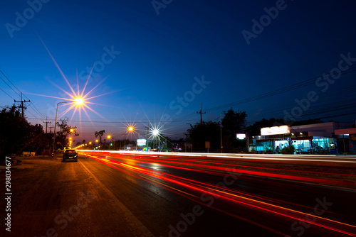 Top veiw Car lights, night road,light trails on motorway highway at night, long exposure abstract urban background,Sisaket province,Thailand.