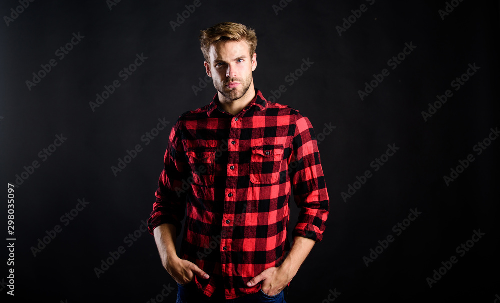 Naklejka premium Barbershop and beauty salon. Hipster black background. Standards of manliness or masculinity. Handsome well groomed man in checkered shirt. Manliness concept. Meaning of modern manliness. Male beauty