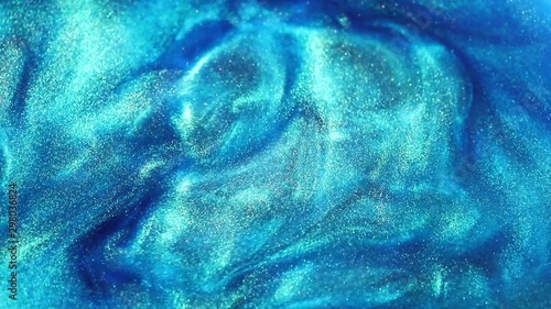 thick turquoise liquid with a pearly sheen. abstract background