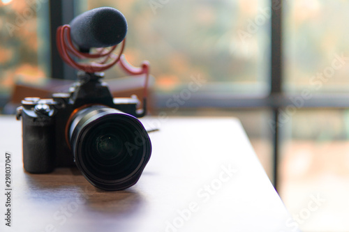 camera with microphone focus at lens no wood table