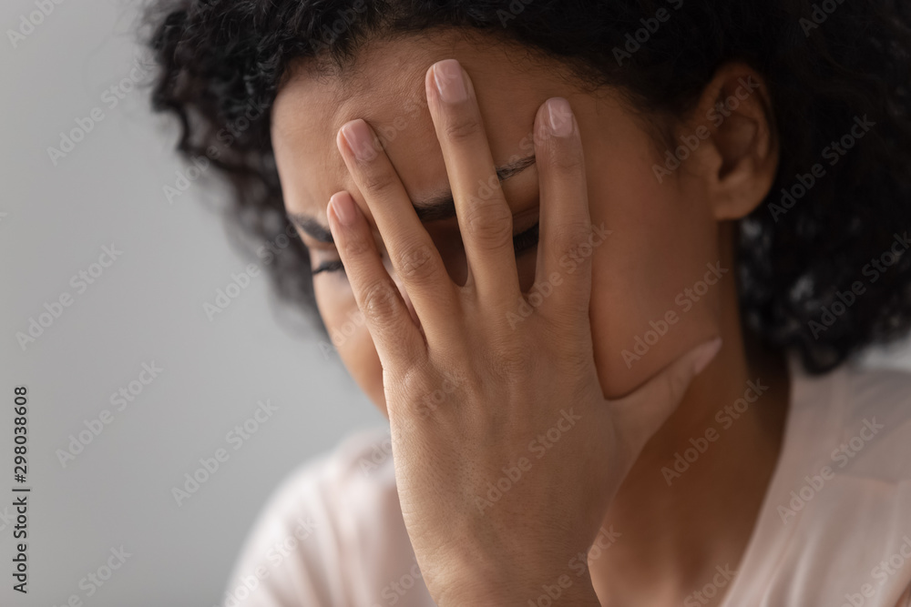 Close up of upset black woman suffering from depression Close up of upset black woman suffering from depression