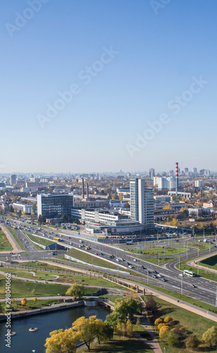 City architectural landscape Minsk. Office buildings of the road and parks. View from the roof with blue sky.