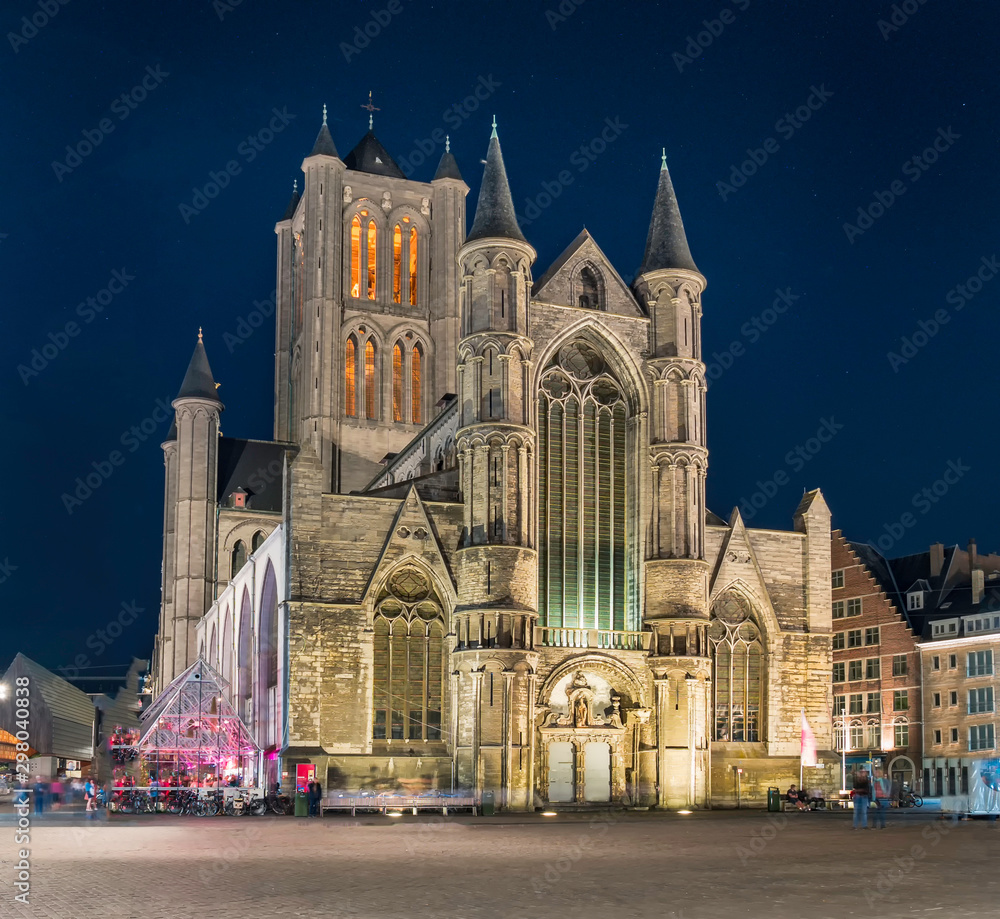 The Saint Nicholas Church facade in Ghent at night. One of the most important buildings and landmarks in Romanesque and Scheldt Gothic style in the historic center of Gent, Belgium.