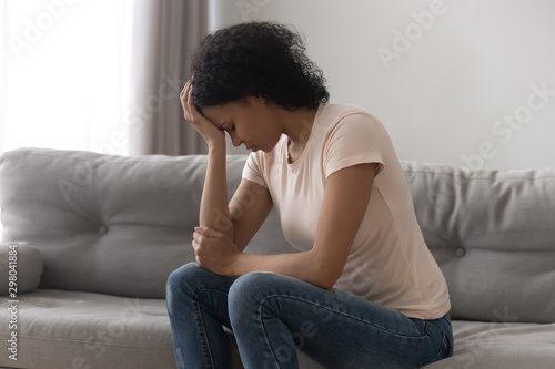 Stressed black woman suffering from depression at home © fizkes