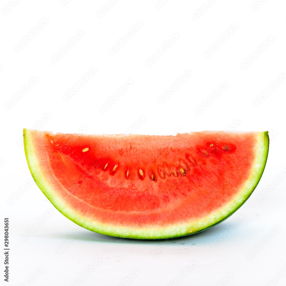 Studio shot single slice cut of mini organic watermelon isolate on white Studio shot single slice cut of mini organic watermelon isolate on white