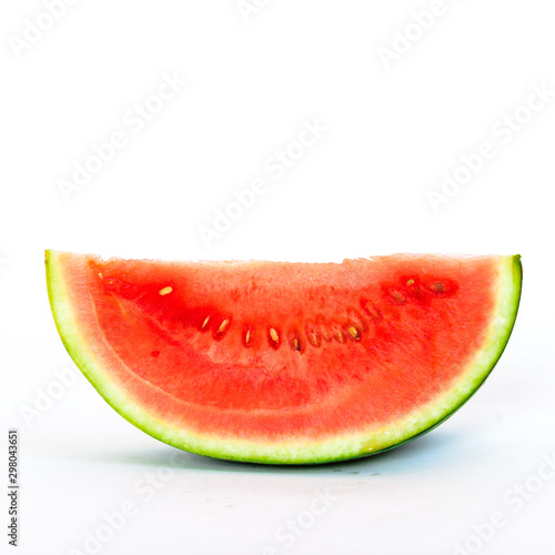 Studio shot single slice cut of mini organic watermelon isolate on white