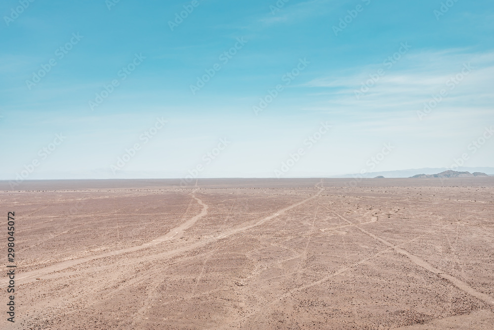 Obraz premium Nazca Lines in the desert of Peru, mystical signs geoglyphs in the sand, South America