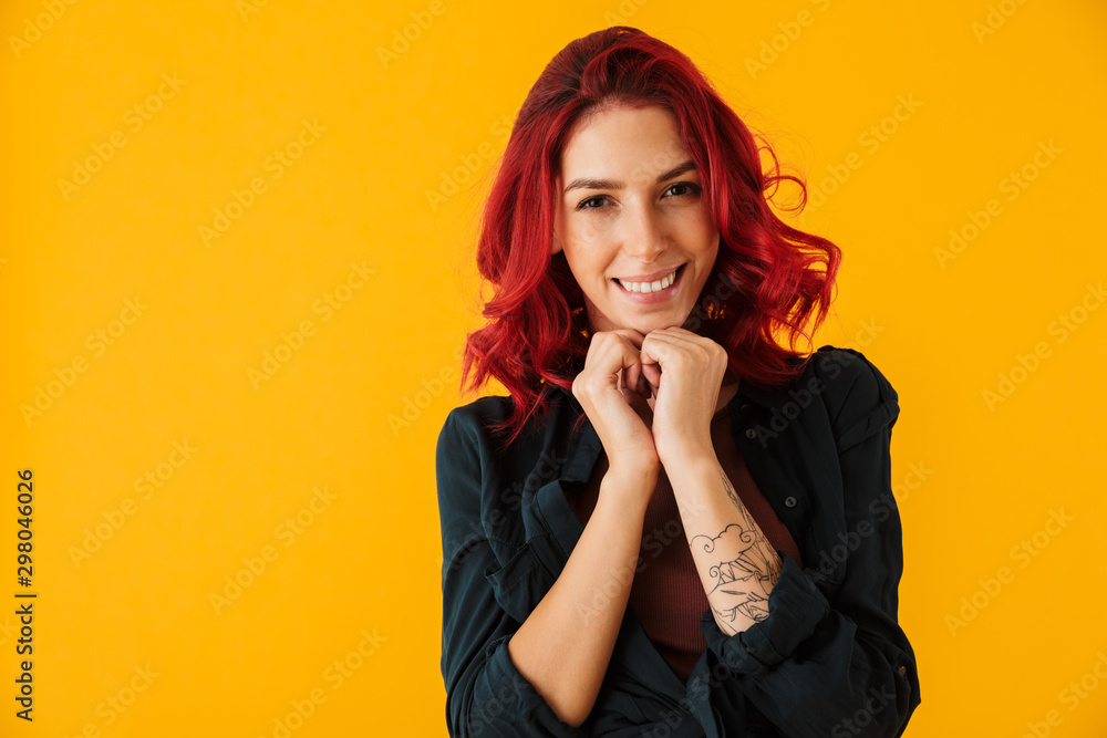 Image of caucasian joyful woman smiling and looking at camera Image of caucasian joyful woman smiling and looking at camera