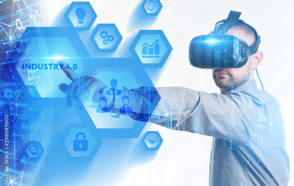 Business, Technology, Internet and network concept. Young businessman working on a virtual screen of the future and sees the inscription: Business, Technology, Internet and network concept. Young businessman working on a virtual screen of the future and sees the inscription: