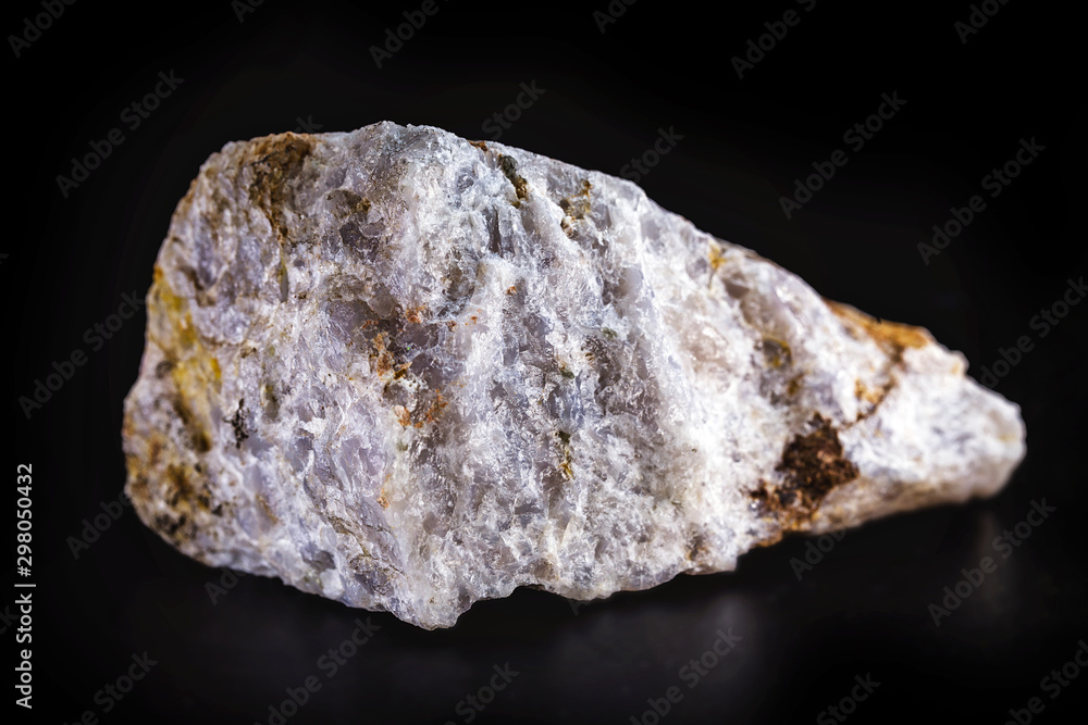 Rock, isolated on black background, stones or gravel used for construction of buildings, roads and for landscaping (close up). Rock, isolated on black background, stones or gravel used for construction of buildings, roads and for landscaping (close up).