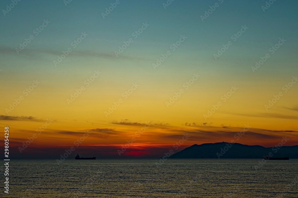 Naklejka premium sunset at sea in view of the ship