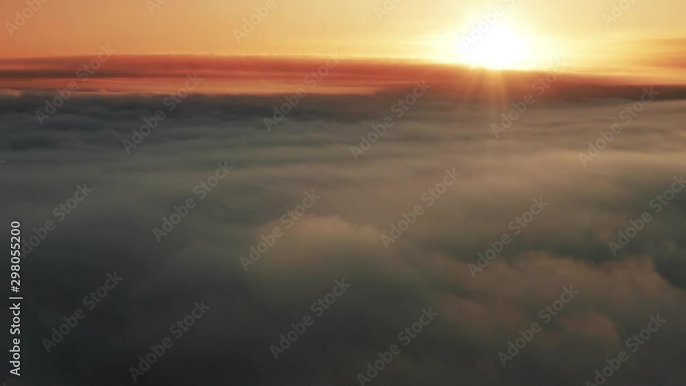 Majestic time lapse view above clouds at sunset