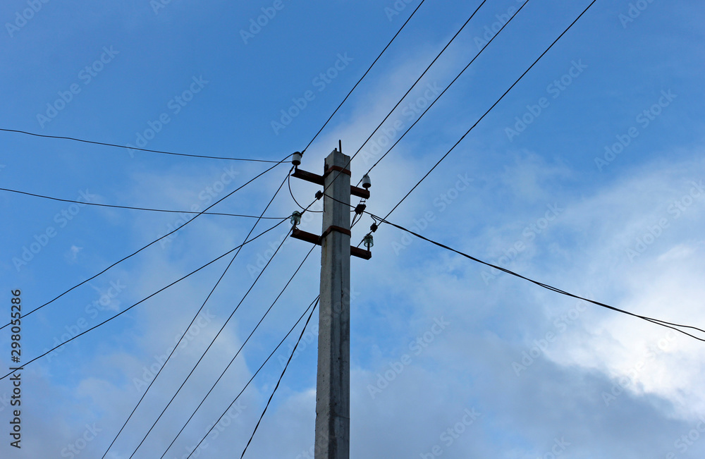 power pole with wires against a blue sky with clouds power pole with wires against a blue sky with clouds