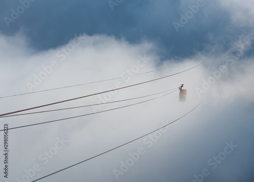 Cable car ride in the clouds.