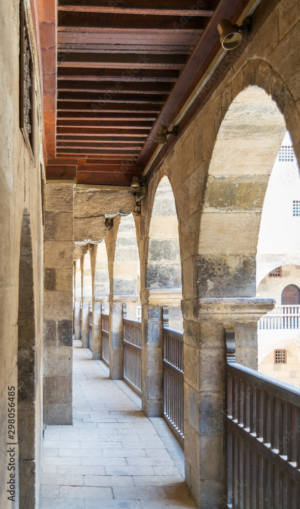 One of the arcades surrounding the courtyard of old historic public caravansary building - Wikala Bazaraa - Medieval Cairo, Egypt