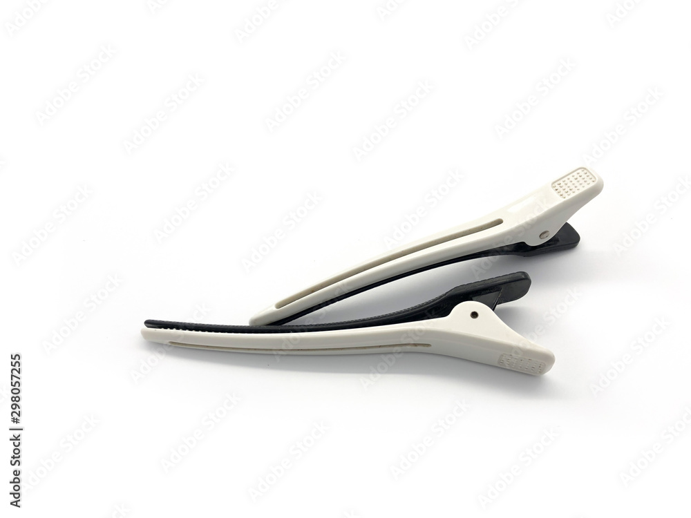 Black with white real hairdresser hair clip isolated on a white background.