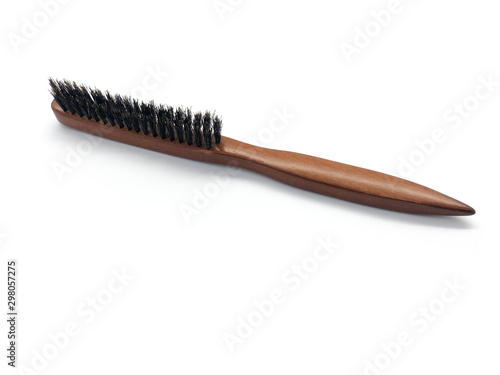 Professional hairdresser wooden backcombing brush isolated on white background. 