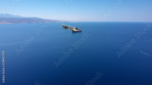 Large Ship under attack in Persian gulf sea With fire Smoke And Helicopter Aerial Illstration