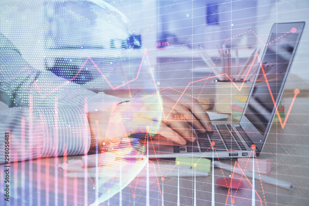 Double exposure of stock market graph with man working on laptop on background. Concept of financial analysis. Double exposure of stock market graph with man working on laptop on background. Concept of financial analysis.