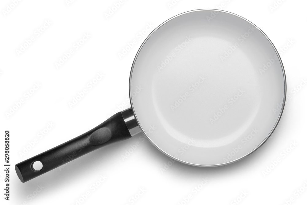 Black pan with white ceramic coating on a white background. Top view Black pan with white ceramic coating on a white background. Top view
