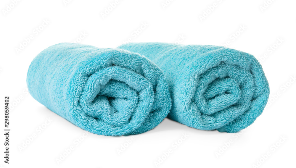 Rolled clean turquoise towels on white background Rolled clean turquoise towels on white background